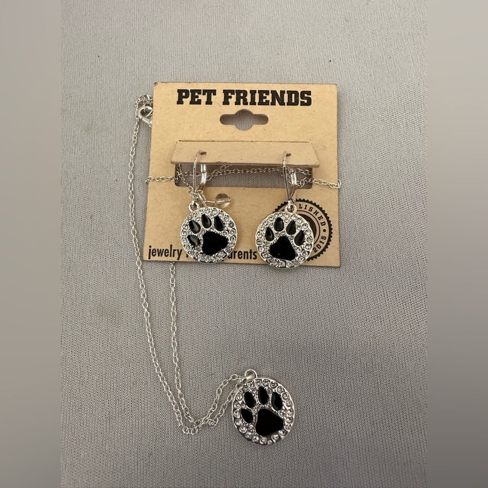Pet Friends necklace and earrings set in silver tone with black enamel paws